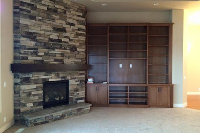 Example of a large classic formal and open concept carpeted and beige floor living room design in Portland with beige walls, a standard fireplace, a stone fireplace and no tv