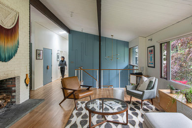 Example of a mid-century modern living room design in Other