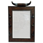 Jorge Kurczyn Furniture - Cuerno Mirror - Design for Crows Nest Trading Co. Catalog by Jorge Kurczyn. Features fully framed padded embossed leather with horn hangers and horn center piece all accented with old brass nailhead finish. All products are built to order.