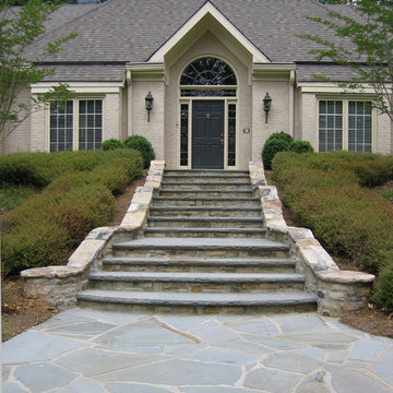 Grand Bluestone and Fieldstone staircase includes cheek walls, landings and colu