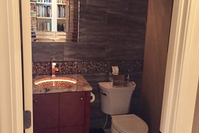 Example of a trendy powder room design in Cleveland