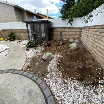Before: Uneven Side Yard with Exposed Soil & Outdated Rock Landscaping | Winnetk