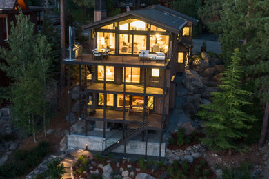 Transitional brown house exterior idea in Other