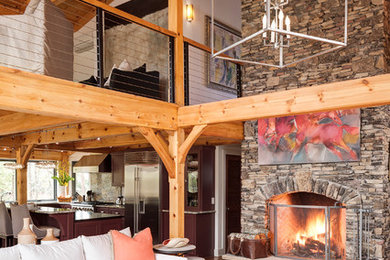 Family room - mid-sized contemporary loft-style medium tone wood floor family room idea in Atlanta with white walls, a standard fireplace, a stone fireplace and no tv