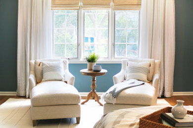 Inspiration for a large timeless master light wood floor bedroom remodel in Columbus with blue walls