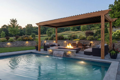 Inspiration for a small timeless backyard concrete paver pool remodel in Cleveland