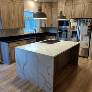 Double Waterfall Quartz island with Black Granite Perimeter