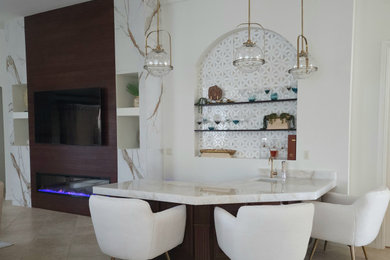 Inspiration for a mediterranean home bar remodel in Miami