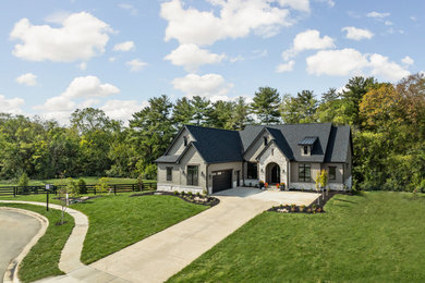 Mid-sized country one-story concrete fiberboard exterior home photo in Columbus with a shingle roof and a black roof