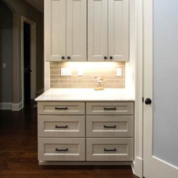 White Kitchen with Espresso Island, Galley Sink, Cambria Britannica Countertop