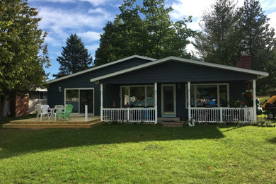 Example of a mid-sized classic exterior home design in Other