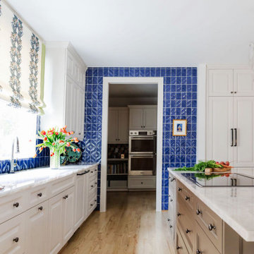 Colorful Houston Kitchen with Bold Blue Tile Backsplash and Custom Cabinets