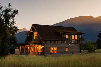 Inspiration for a two-story wood gable roof remodel in Other with a shingle roof