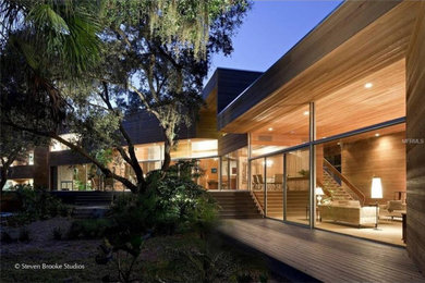 Example of a trendy home design design in Tampa