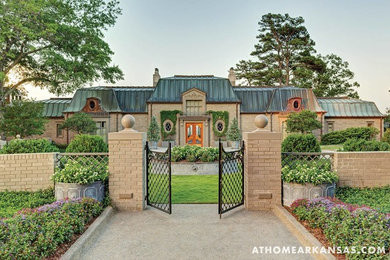 Huge traditional two-story brick exterior home idea in Little Rock