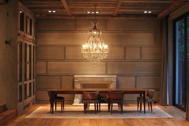 Trendy medium tone wood floor dining room photo in Toronto with a standard fireplace