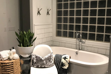 Inspiration for a mid-sized modern master white tile and ceramic tile ceramic tile, gray floor, double-sink and wood wall bathroom remodel in Omaha with gray cabinets, white walls, an undermount sink, quartz countertops, white countertops and a built-in vanity
