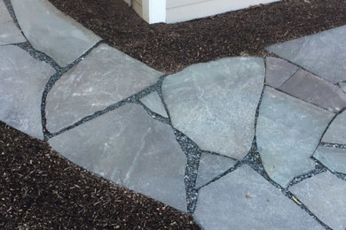 Design ideas for a contemporary backyard stone walkway in Philadelphia.