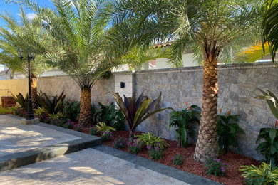 Photo of a tropical home design in Miami.
