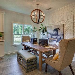 Kitchen/dining room combo - mid-sized country laminate floor kitchen/dining room combo idea in Jacksonville with white walls and no fireplace