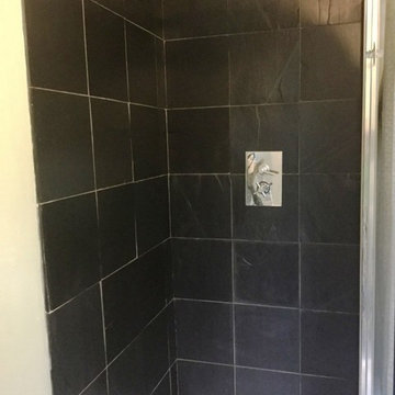Removing Limescale staining from a Black Limestone Shower Cubicle in Everdon
