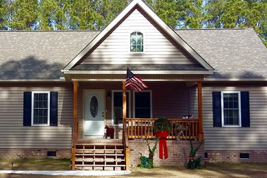Example of a mid-sized country gray two-story concrete fiberboard exterior home design in Other with a shingle roof