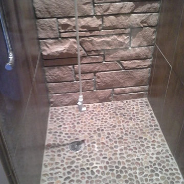 shower with stone floor