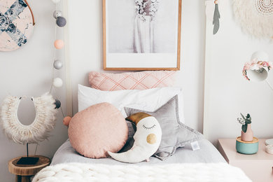 Childrens' room - mid-sized contemporary childrens' room idea in Melbourne with white walls