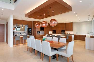 Photo of an expansive contemporary open plan dining in Vancouver with ceramic floors, beige floor and white walls.