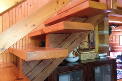 Staircase - mid-sized rustic wooden straight open and wood railing staircase idea in Other
