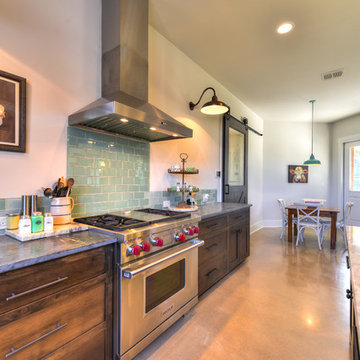 Contemporary Stainless Steel Vent hood with glass tile backsplash