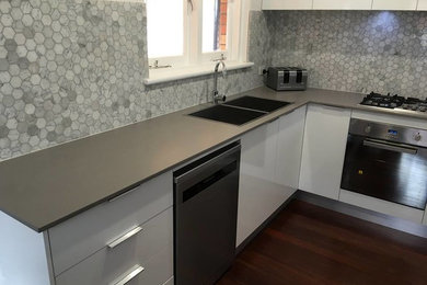 Design ideas for a modern kitchen in Perth with a double-bowl sink and quartz benchtops.