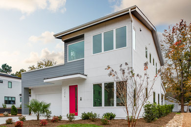 Mid-sized contemporary multicolored two-story mixed siding house exterior idea in Charlotte with a hip roof and a shingle roof