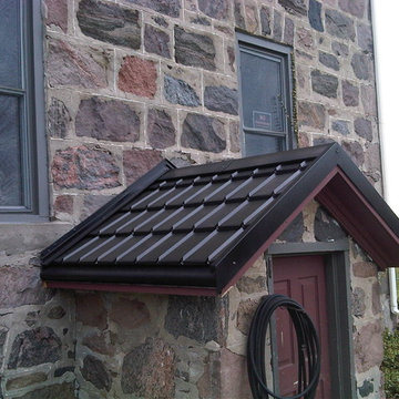 Ontario stone houses with Hy-Grade's permanent "cure" from roof shingles