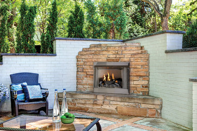 Photo of a mid-sized traditional backyard patio in Tampa with a fire feature, concrete slab and no cover.