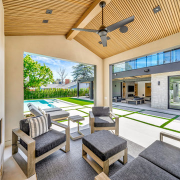 Covered Outdoor Lounge with Wood Slat Ceiling & Pool View