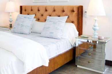 Inspiration for a large eclectic guest plywood floor bedroom remodel in Miami with white walls