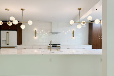Large minimalist light wood floor eat-in kitchen photo in Other with a single-bowl sink, flat-panel cabinets, white cabinets, marble countertops, white backsplash, white appliances, an island and white countertops