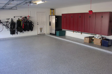 Mid-sized minimalist attached two-car garage workshop photo in Houston