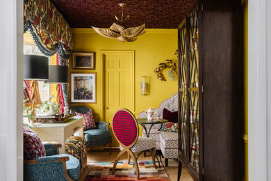 Example of an eclectic wallpaper ceiling and wallpaper dining room design in Charlotte with yellow walls