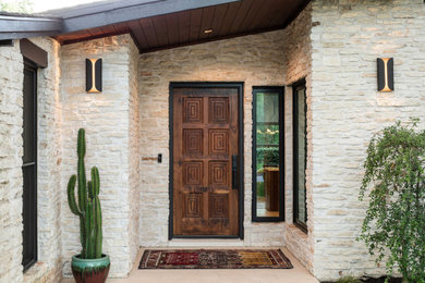Mid-century modern one-story exterior home idea in Austin with a shingle roof