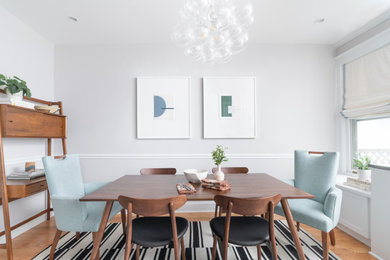 Danish medium tone wood floor dining room photo in DC Metro with green walls and no fireplace