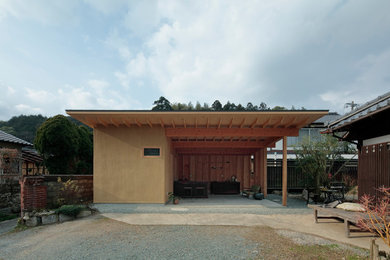 福岡にある小さなおしゃれな家の外観 (漆喰サイディング) の写真