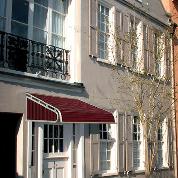 A Burgundy Aluminum Door Canopy on a historic Boston building