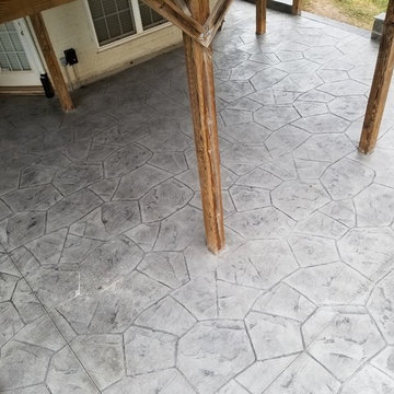 C-Stamped concrete patio with a wall