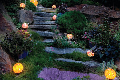 Design ideas for a large rustic full sun backyard stone landscaping in Philadelphia for summer.