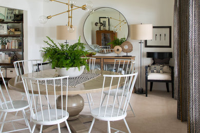 This is an example of an eclectic dining room in Denver with white walls.