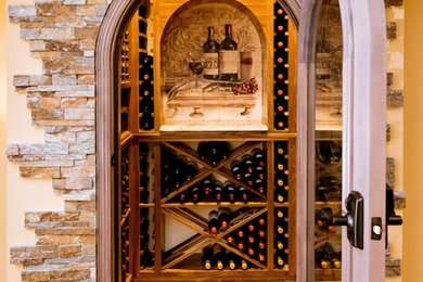 Example of a mid-sized tuscan wine cellar design in Philadelphia