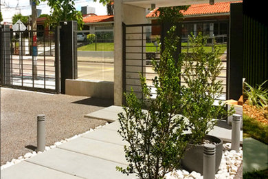 Inspiration for a large contemporary entryway remodel in Other with gray walls and a black front door