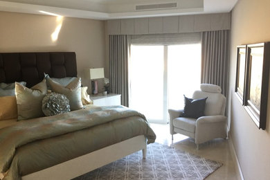 Bedroom - mid-sized traditional master marble floor and beige floor bedroom idea in Orange County with beige walls and no fireplace